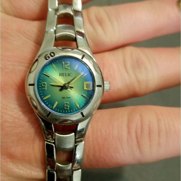 Silver Relic watch with a two tone blue and green face